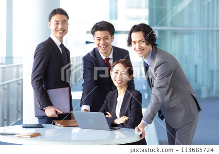 Business men and women looking at camera 113685724