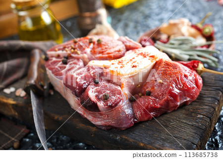 raw meat on board, meat with spice 113685738