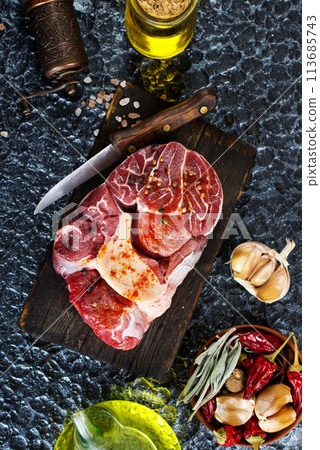 raw meat on board, meat with spice 113685743