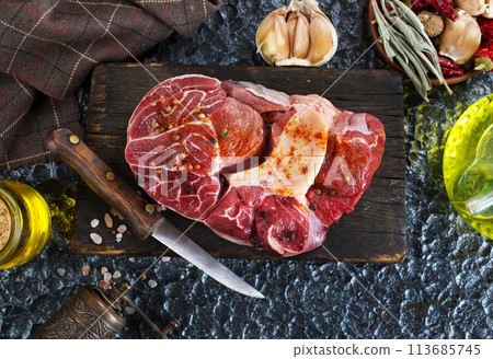 raw meat on board, meat with spice 113685745