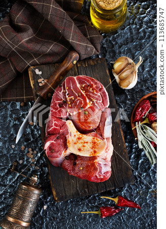 raw meat on board, meat with spice 113685747
