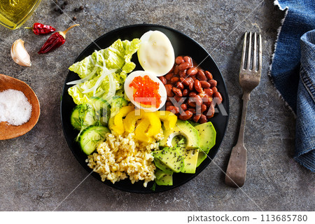 Buddha bowl, balanced food, vegetarian menu. Eggs, avocado, salad lettuce, bulgur, spice 113685780