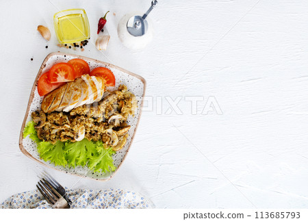 baked chicken breast with mushroom quinoa and salad 113685793