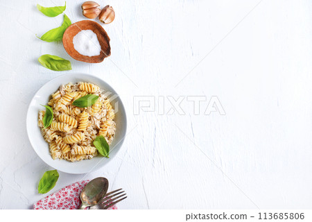 boiled pasta with minced meat and basil 113685806