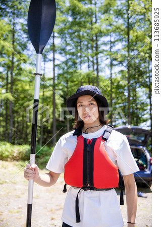 man enjoying kayaking man enjoying kayaking 113685925