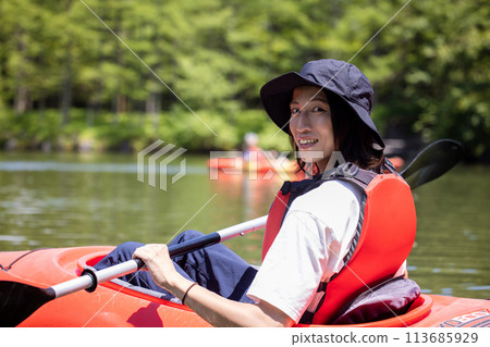 man enjoying kayaking man enjoying kayaking 113685929