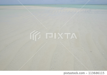 Kondoi Beach at low tide, with its white sandy beach Kondoi Beach at low tide, with its white sandy beach 113686115