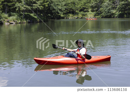 man enjoying kayaking man enjoying kayaking 113686138