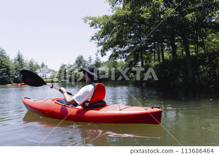 man enjoying kayaking man enjoying kayaking 113686464
