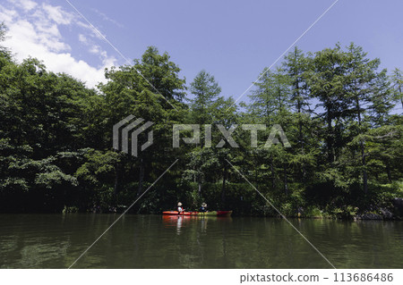 family enjoying kayaking 113686486