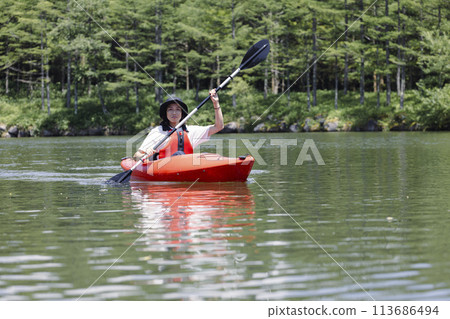 man enjoying kayaking 113686494