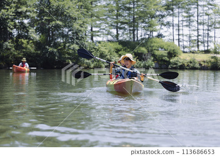 family enjoying kayaking family enjoying kayaking 113686653