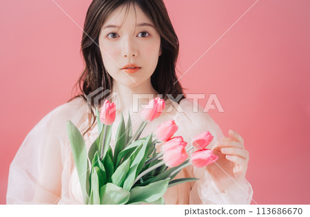 Beauty image of young woman and flowers 113686670