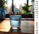 Glass of pure water on kitchen table 113687214