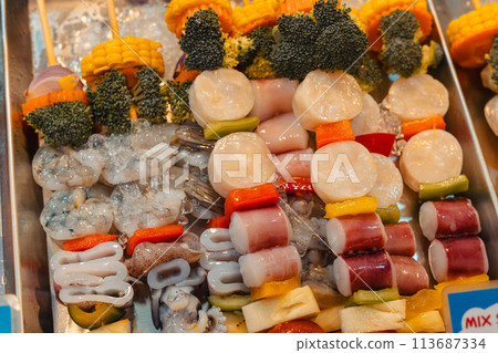 Seafood barbecue skewers for sale at street food Seafood barbecue skewers for sale at street food 113687334