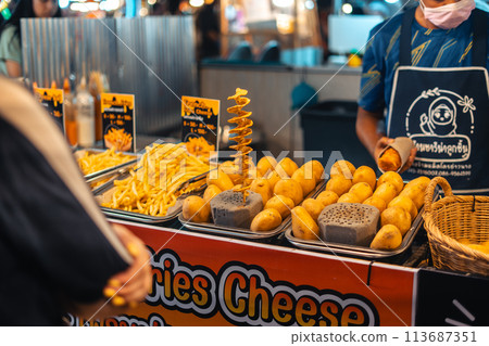 Fried spiralized potato skewers for sale at Street Food Market Fried spiralized potato skewers for sale at Street Food Market 113687351
