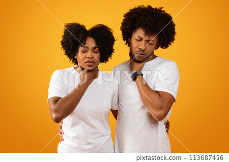 Unhealthy sick african american couple suffering from pain in throat Unhealthy sick african american couple suffering from pain in throat 113687456