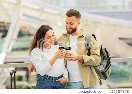 Cheers For Trip. Happy couple clinking cups with takeaway coffee at airport 113687558