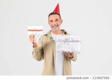 Senior man with gift certificate and present 113687560