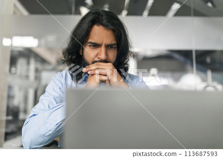 Indian man manager looking for creative solution Indian man manager looking for creative solution 113687593