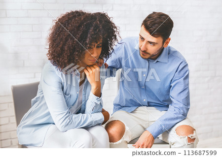 Supportive people comforting depressed black woman at group therapy meeting Supportive people comforting depressed black woman at group therapy meeting 113687599