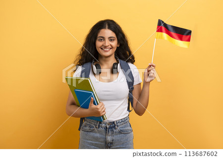 Student holding a German flag and notebooks Student holding a German flag and notebooks 113687602