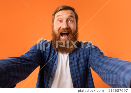 Excited Man With Red Beard Shouting Spreading Hands, Orange Background Excited Man With Red Beard Shouting Spreading Hands, Orange Background 113687697