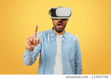 Person using VR headset pointing up Person using VR headset pointing up 113687700