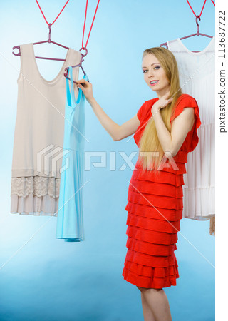 Woman choosing clothes in shop 113687722