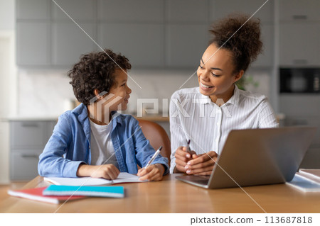 Mother and son having a study session 113687818