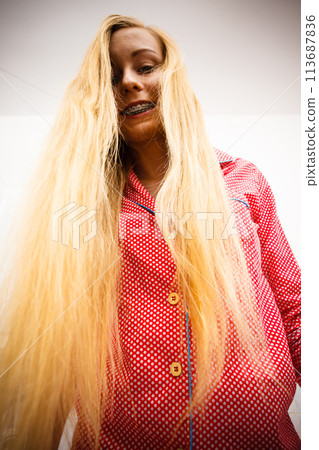 Woman showing her long blonde hair 113687836