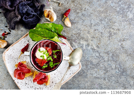 Traditional Ukrainian Russian borscht . Bowl of red beet root soup borsch with white cream . Beet Root delicious soup . Traditional Ukrainian Russian borscht . Bowl of red beet root soup borsch with white cream . Beet Root delicious soup . 113687908