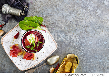 Traditional Ukrainian Russian borscht . Bowl of red beet root soup borsch with white cream . Beet Root delicious soup . Traditional Ukrainian Russian borscht . Bowl of red beet root soup borsch with white cream . Beet Root delicious soup . 113687909