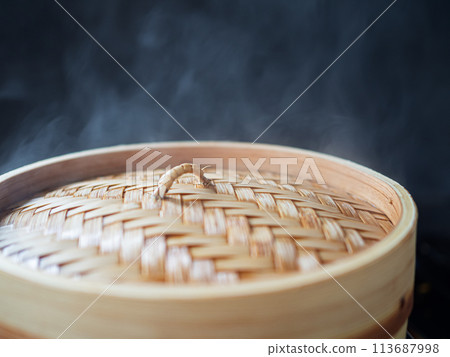 Steam rising from a bamboo steamer Steam rising from a bamboo steamer 113687998
