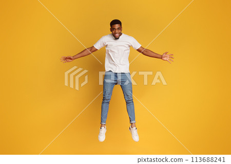 Funny young black man jumping on the air Funny young black man jumping on the air 113688241