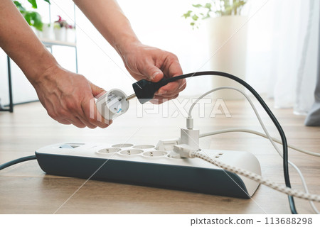 Power strip socket with connected plugs. 113688298