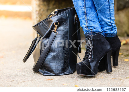 Female foot in elegant black shoes. Female foot in elegant black shoes. 113688367