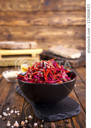 Fresh vegetable salad with sauerkraut cabbage, grated carrots and beetroots Fresh vegetable salad with sauerkraut cabbage, grated carrots and beetroots 113688615