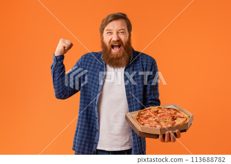 Joyful man holds pizza box shouting gesturing yes emotionally, studio Joyful man holds pizza box shouting gesturing yes emotionally, studio 113688782