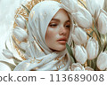 Arab Woman in White Hijab with Golden Accents and White Tulips Flowers 113689008