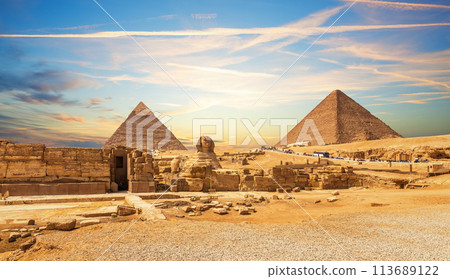 The Great Sphinx next to the Pyramids of Egypt at sunset, Giza desert 113689122