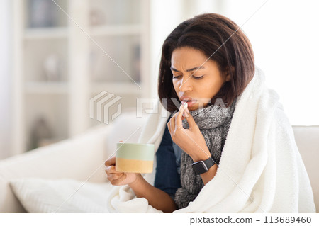 Sick african american woman feeling unwell at home 113689460