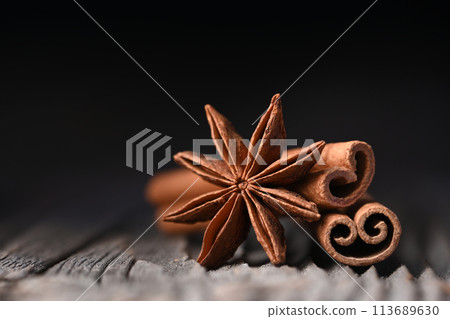 Anise star and cinnamon sticks on wooden board Anise star and cinnamon sticks on wooden board 113689630