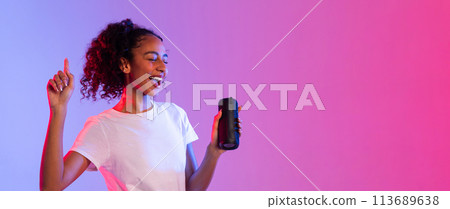 Happy black lady enjoying music with speaker on dual-tone background, panorama, free space Happy black lady enjoying music with speaker on dual-tone background, panorama, free space 113689638