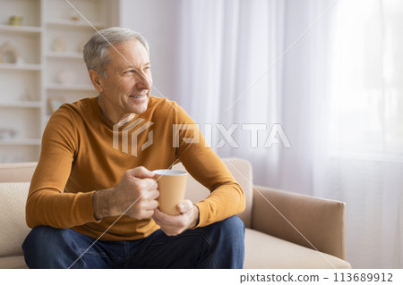 Senior man relaxing with a cup of coffee Senior man relaxing with a cup of coffee 113689912