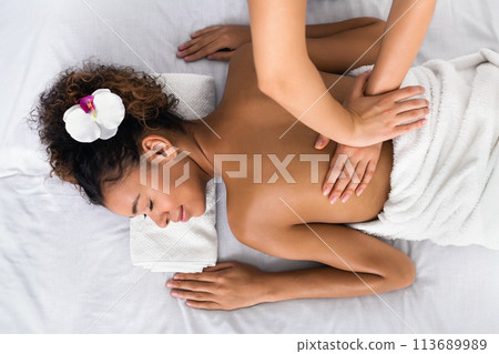 Woman receiving back massage in spa salon, top view 113689989