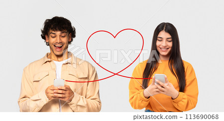 A man in a beige jacket and a woman in an orange sweater, both with joyful expressions A man in a beige jacket and a woman in an orange sweater, both with joyful expressions 113690068