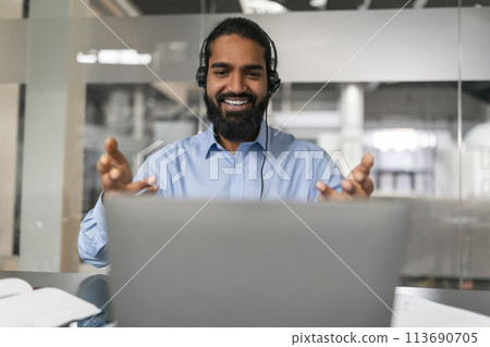 Smiling man gesturing in video call Smiling man gesturing in video call 113690705