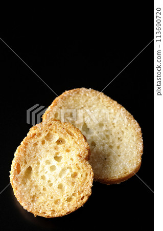 Rusks photographed against a black background 113690720