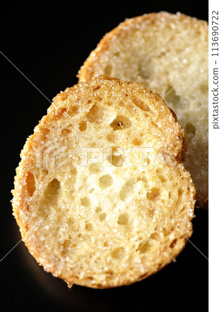 Rusks photographed against a black background Rusks photographed against a black background 113690722